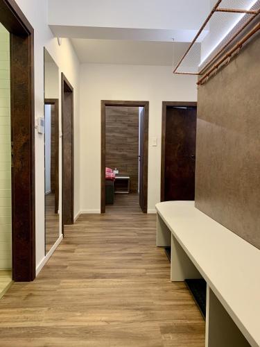 a corridor of an office with a long hallway at Apartmánový dom Poludnica I., Chopok Juh, Jasná in Tale