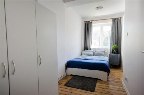 Posteľ alebo postele v izbe v ubytovaní Apartament Viktoria