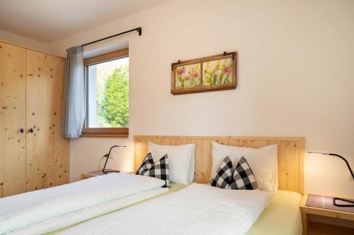 Posteľ alebo postele v izbe v ubytovaní Spitalerhof Apartment & Sauna