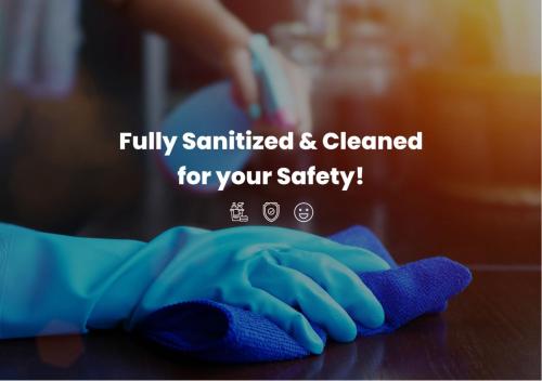 a person with a cleaning glove on a counter at Limassol Old Town Mansion in Limassol