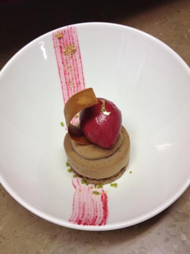 a white plate with a dessert on it at Hotel Restaurant Le Dauphin et Le Spa du Prieuré in Caen