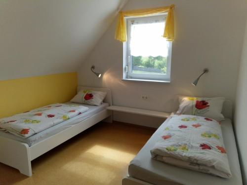 Кровать или кровати в номере Ferienanlage Karolinenhof