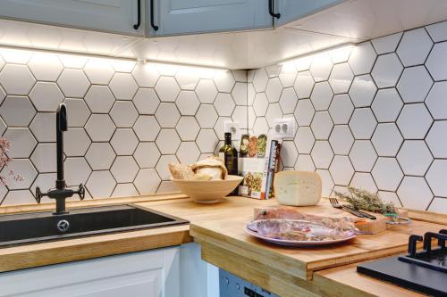 a kitchen with a counter top with a sink and a counter top at Apartments Forum 2 in Pula