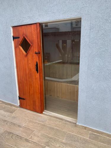 a wooden door with a window in a building at Resort Bevilacqua in Budva