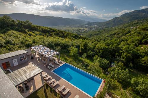 an aerial view of a house with a swimming pool at Resort Bevilacqua in Budva