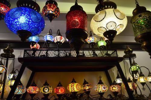 a bunch of different types of lights on a wall at Ayasoluk Hotel & Restaurant in Selcuk