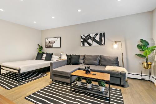 a living room with a couch and a table at Best Studio Apt in Chicago close to Boystown - Oakdale 204 rep in Chicago