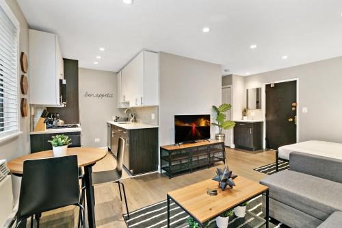 a kitchen and living room with a couch and a table at Best Studio Apt in Chicago close to Boystown - Oakdale 204 rep in Chicago