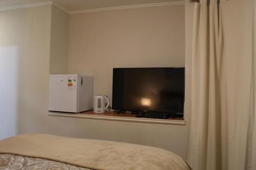Телевізор і / або розважальний центр в habitac privada Bed n Bkf Patagonia Norte - Puerto Varas Homestay - BnB Plus