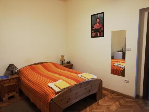a bedroom with a bed and a mirror at Arthouse Lucrezia in Timişoara