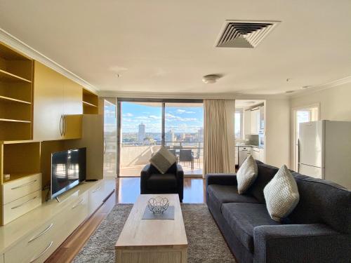 Area soggiorno di Milson Serviced Apartments