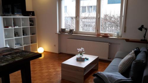 a living room with a couch and a coffee table at Ferienwohnung Hagelstein in Bad Mergentheim