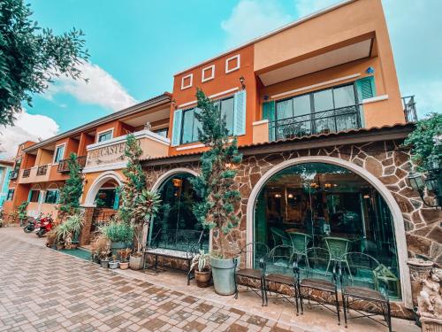 a building with benches in front of it at The Castello Resort in Ko Larn