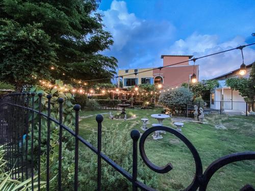 a yard with a fence with lights on it at The Castello Resort in Ko Larn