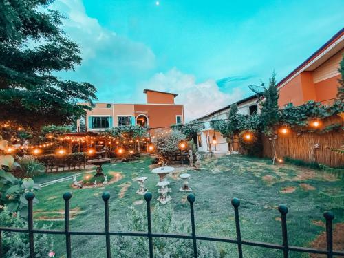 a courtyard with a fountain and a building at The Castello Resort in Ko Larn