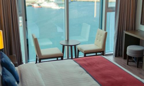 Postel nebo postele na pokoji v ubytování Venezia Hotel and Suite