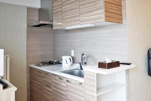 Una cocina o cocineta en Ostay Vermillion Namba