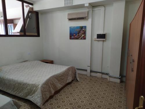 Кровать или кровати в номере Appartamento in centro a Poviglio (Re)