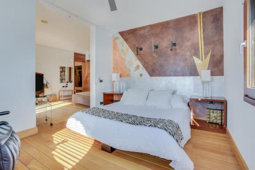 A bed or beds in a room at Villa Abaego