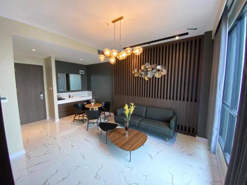 a living room with a couch and a table at Luminor Hotel Tanjung Selor By WH in Tanjungselor