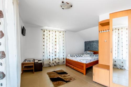 Postel nebo postele na pokoji v ubytování Casa Alex