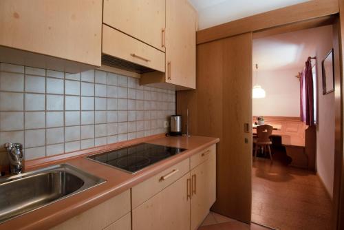 a kitchen with a sink and a counter top at Apartment 3 - Zur Sonne in Laion