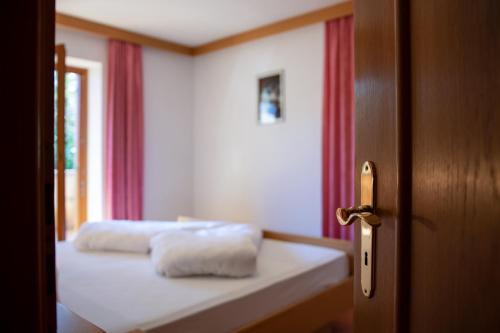 Ένα ή περισσότερα κρεβάτια σε δωμάτιο στο Apartment 3 - Zur Sonne