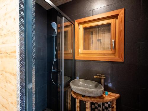 a bathroom with a sink and a shower at Chalet Petit in Kanzelhöhe