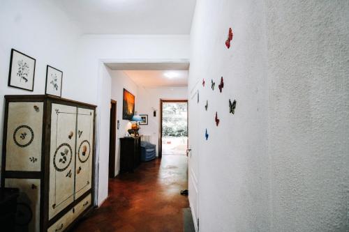 a hallway with a wall with butterfly magnets on it at Villa Lilia by Let in Siena