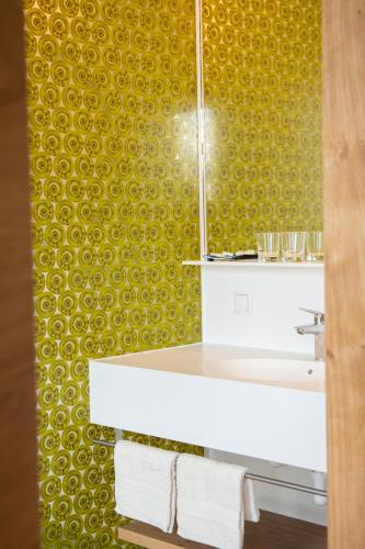 a bathroom with a sink and a mirror at Weingut Assigal in Leibnitz