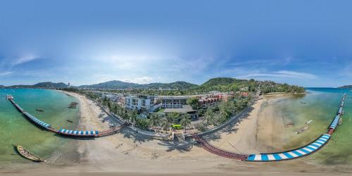 
a scenic view of a beach with a train on it at LIV Hotel Phuket Patong Beachfront - SHA Extra Plus in Patong Beach

