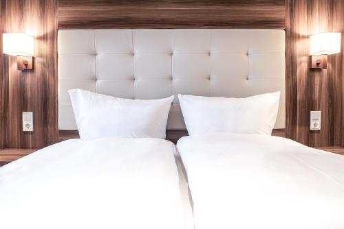 Ένα ή περισσότερα κρεβάτια σε δωμάτιο στο Hotel Ehranger Hof