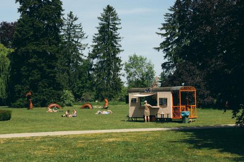 a group of people in a park with a trailer at Vaeshartelt Maastricht in Maastricht