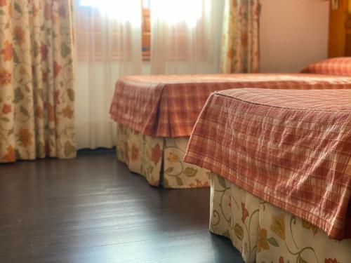 Cama o camas de una habitación en Hotel Labrador