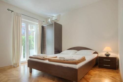 Ліжко або ліжка в номері Mandir apartments - Center