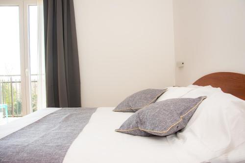Postel nebo postele na pokoji v ubytování Hotel Nuova Barcaccia