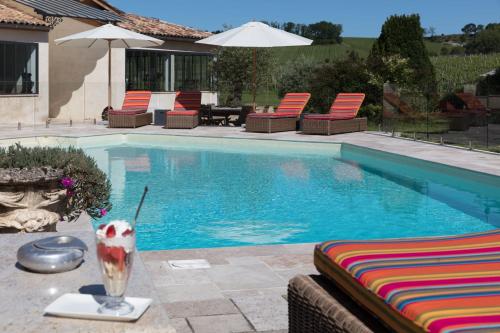 The swimming pool at or near Chateau du Palanquey & SPA