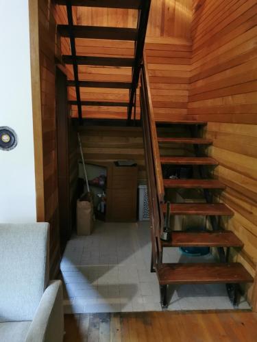 a staircase in a room with wooden walls at Vila Mira Zlatar in Nova Varoš