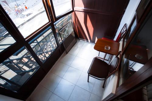 an overhead view of a room with a table and a chair at Aruna Hotel in Astana