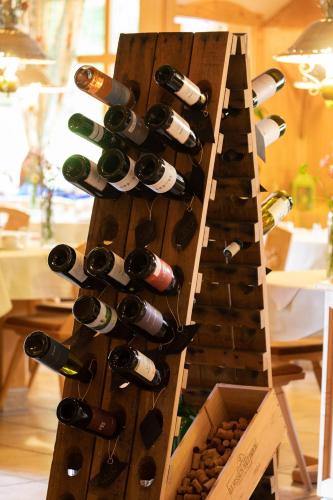 a bunch of bottles of wine on a rack at Landgasthof Paradies in Frickingen