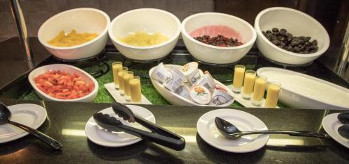 a counter top with bowls of food and ingrediants on it at Crowne Plaza London - Gatwick Airport by IHG in Crawley