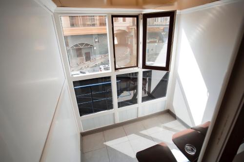 an overhead view of a room with two windows at Aruna Hotel in Astana