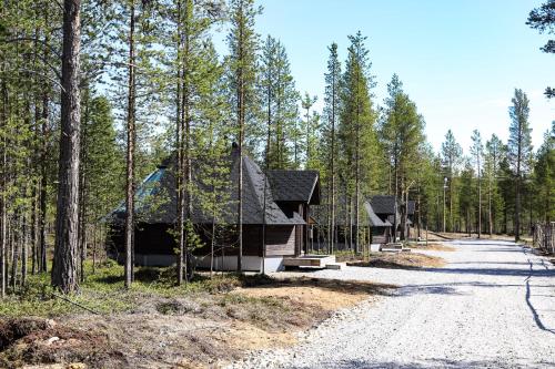 a cabin in the middle of a forest at Aurora Village Ivalo in Ivalo