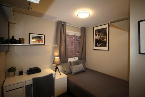 En eller flere senge i et værelse på Kongensgate Apartments