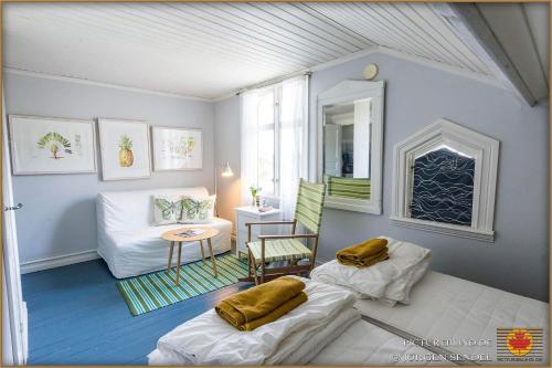 a living room with two bean bags and a chair at Hem till Bengt in Kungshamn