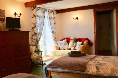 Katil atau katil-katil dalam bilik di Old Camms Holiday Cottages