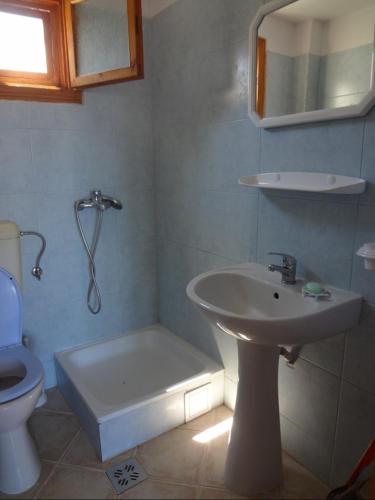 a bathroom with a sink and a toilet at Cozy Studio #2, with terrace in 2 Mai