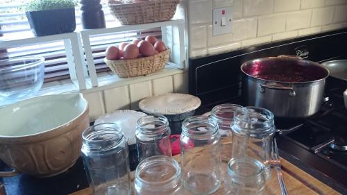 a kitchen with a counter with jars and eggs on it at Corrib View Lodge in Glencorrib