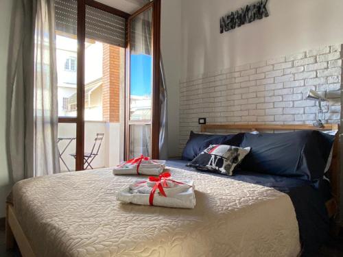 a bedroom with a bed with two towels on it at Sweet Rome B&B in Rome