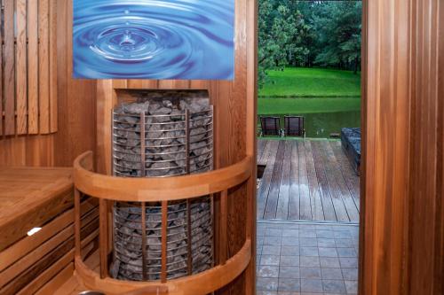 a view from the inside of a room with a pool of water at Kernavės Pajauta in Kernavė